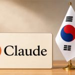 Letrero de Claude junto a una bandera de Corea del Sur